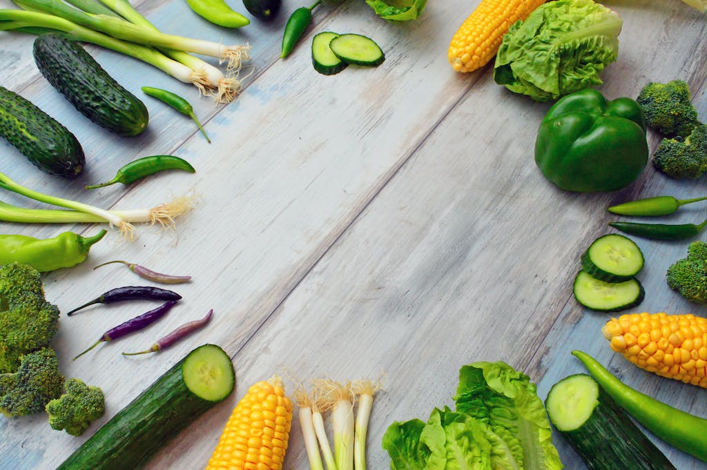 Colorful lettuce seeds, wooden table, NC garden.