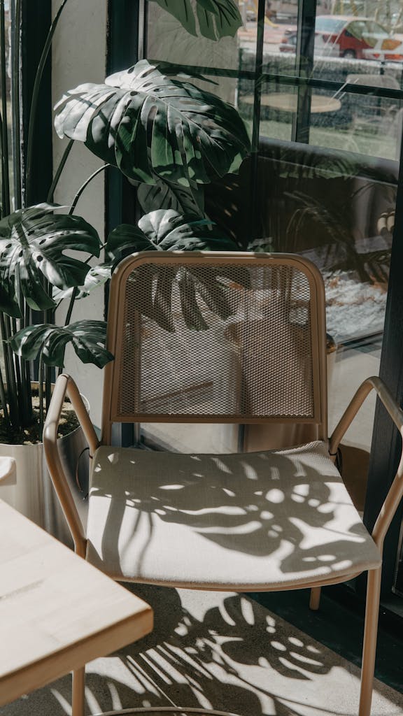 A chair and table in front of a window